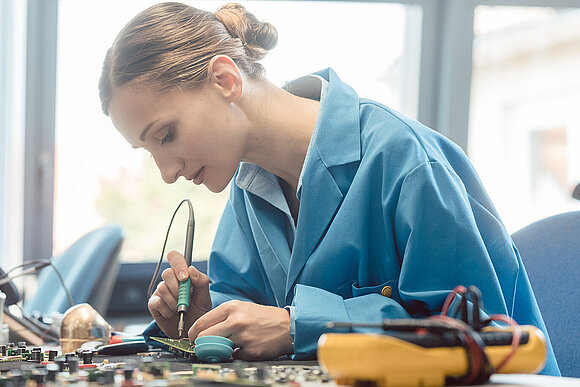 Woman working at soldering station
