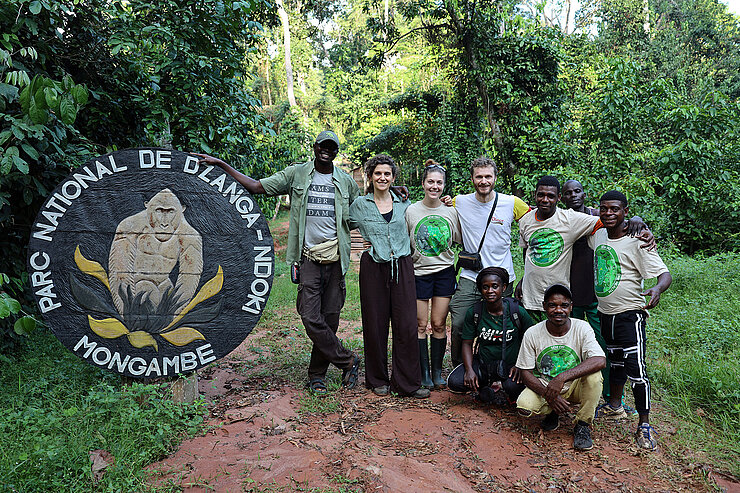 Group photo of eight people outdoors 