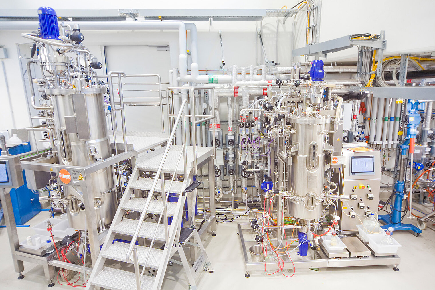 Large industrial fermentation plant made of stainless steel with multiple reactors
