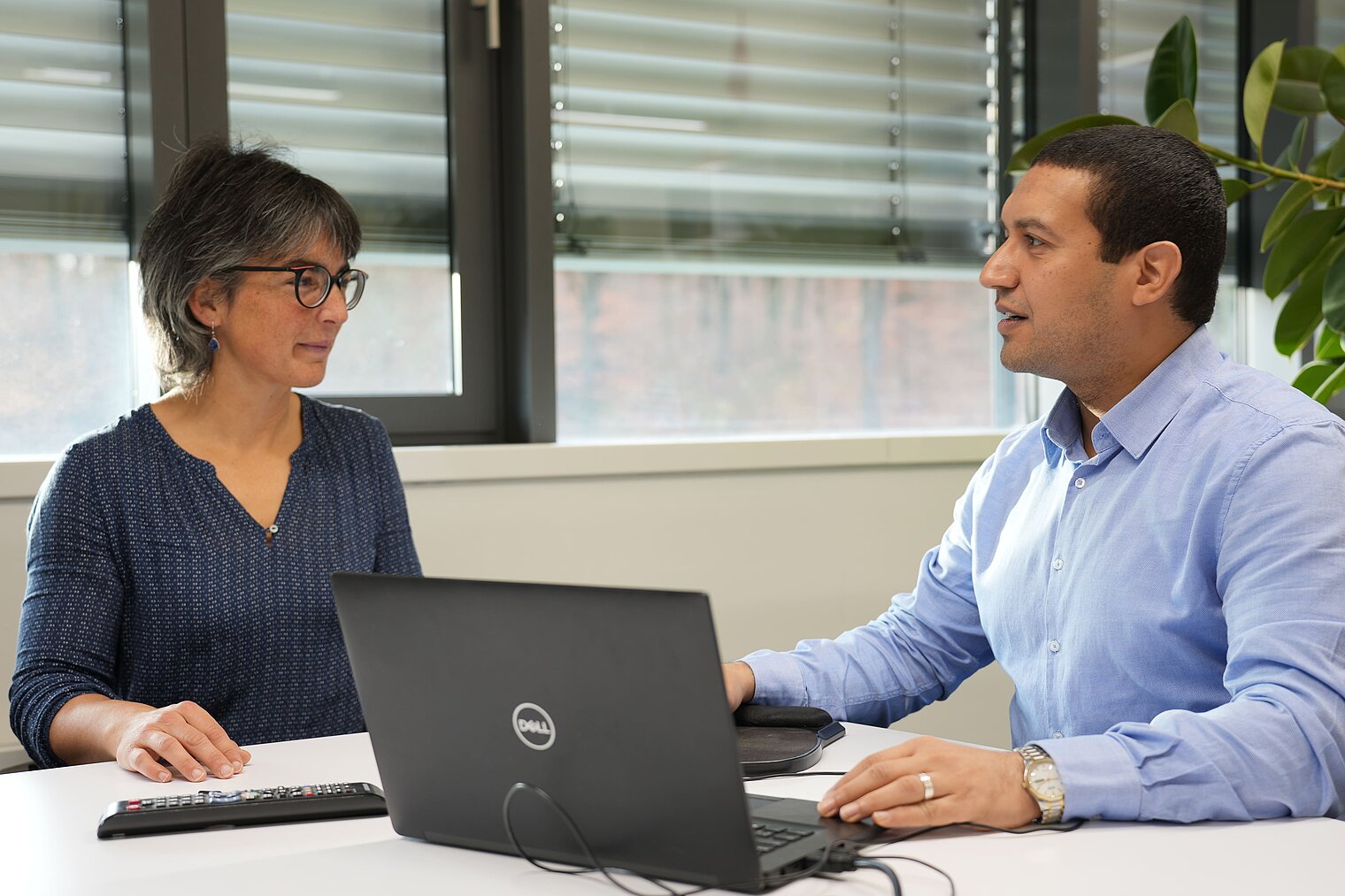 Prof Anna Hirsch and Dr Walid Elgaher sit in front of a laptop
