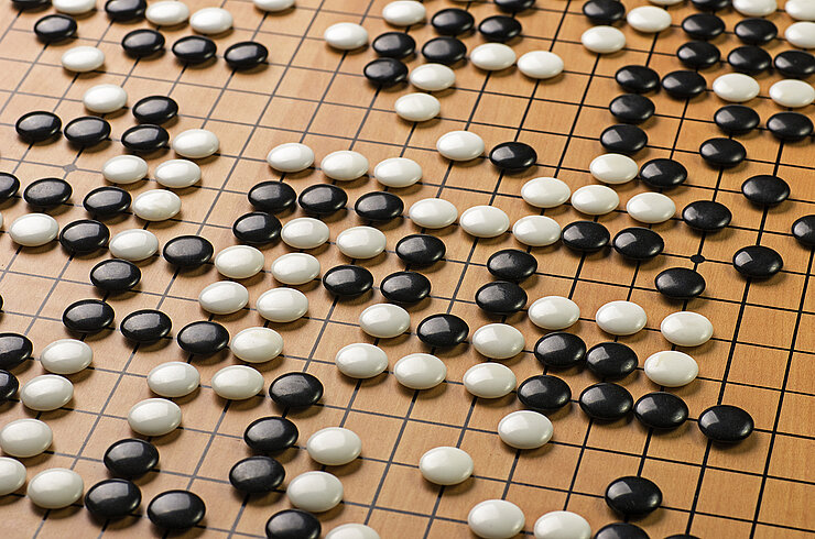 Black and white tiles on a GO board