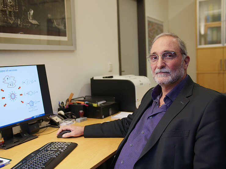 Carlos A. Guzmán at his computer Carlos A. Guzmán at his computer