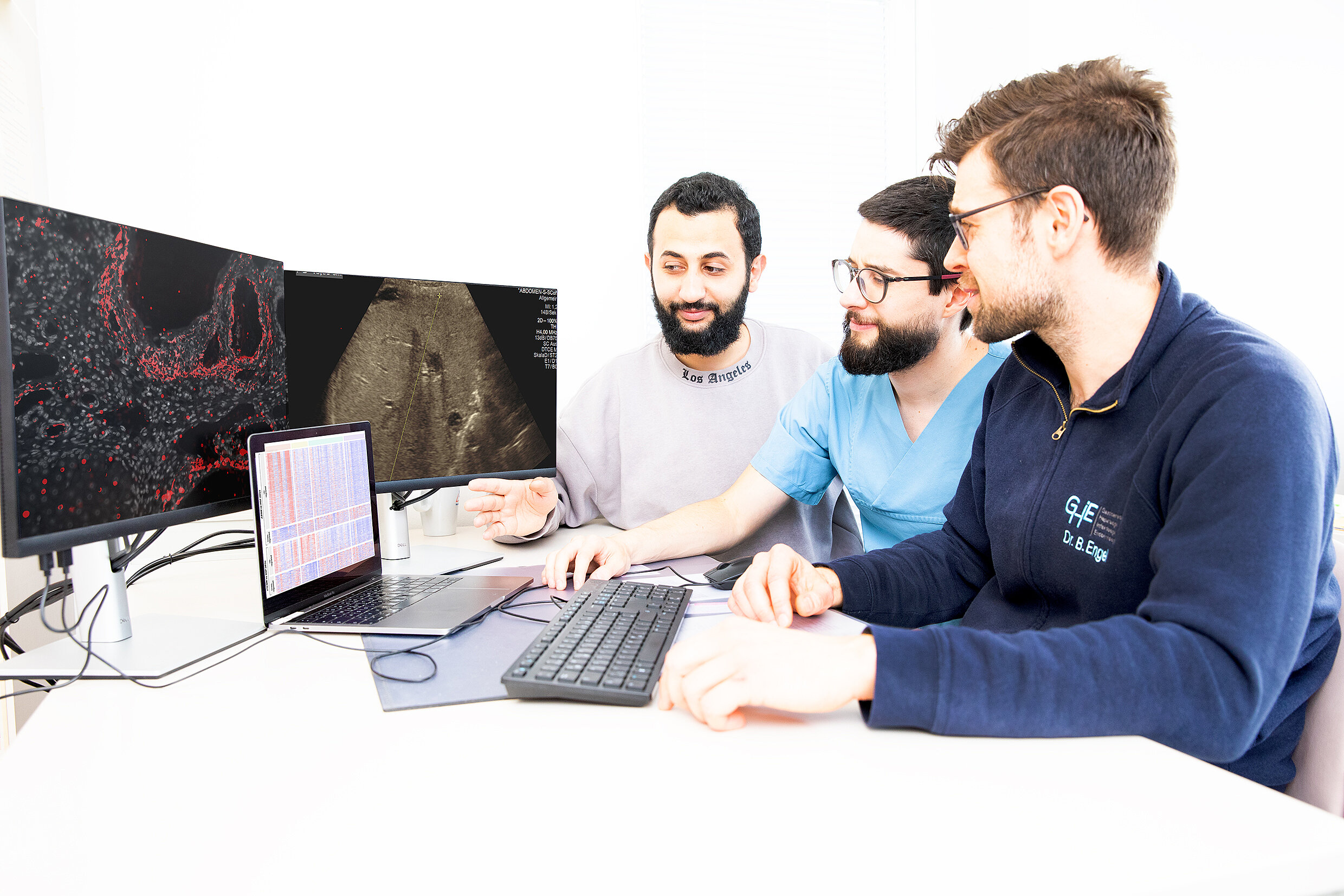 Group of people discussing research findings 