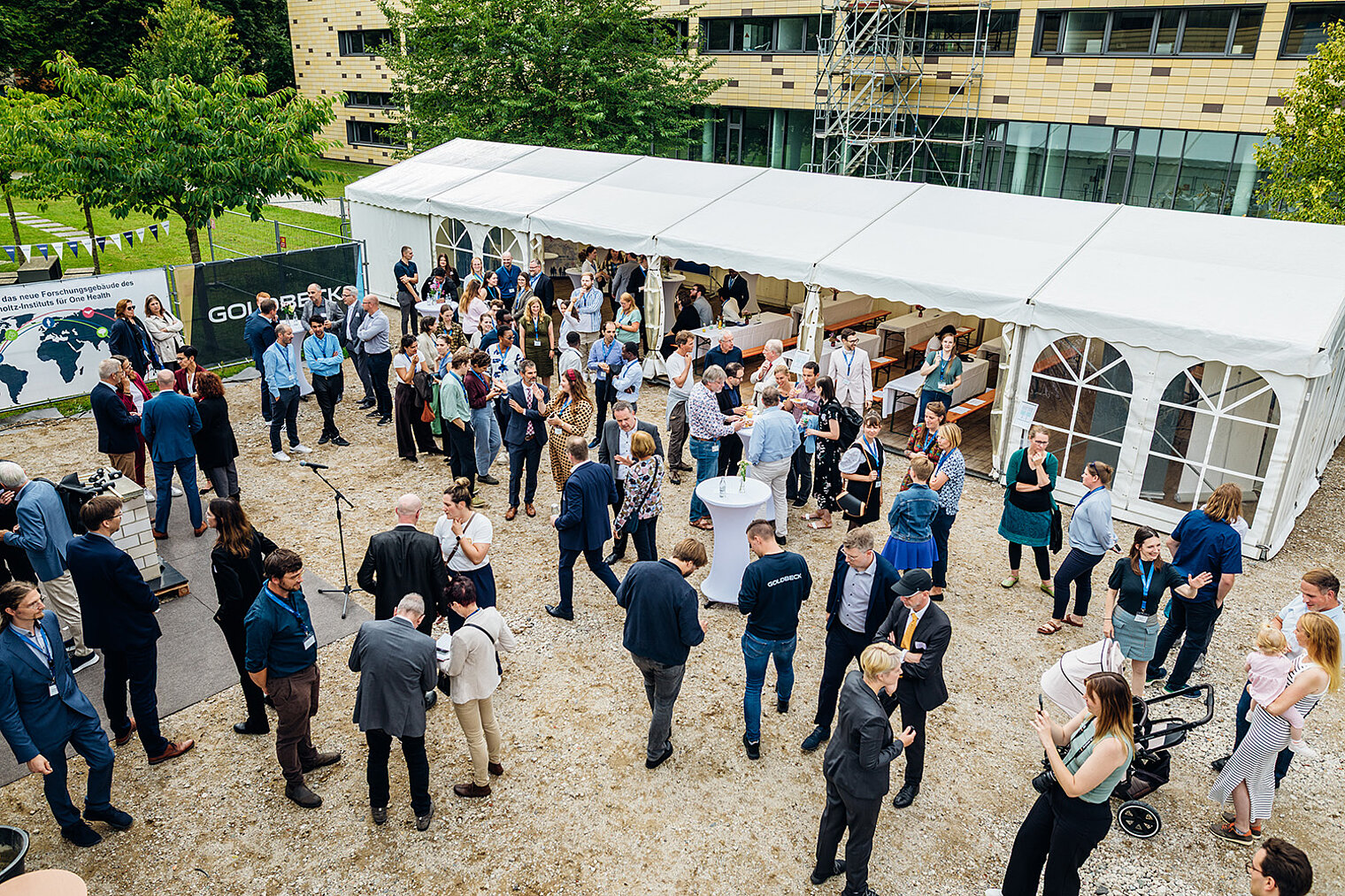 Researchers, partners and guests gather for the ceremonial laying of the foundation stone 
